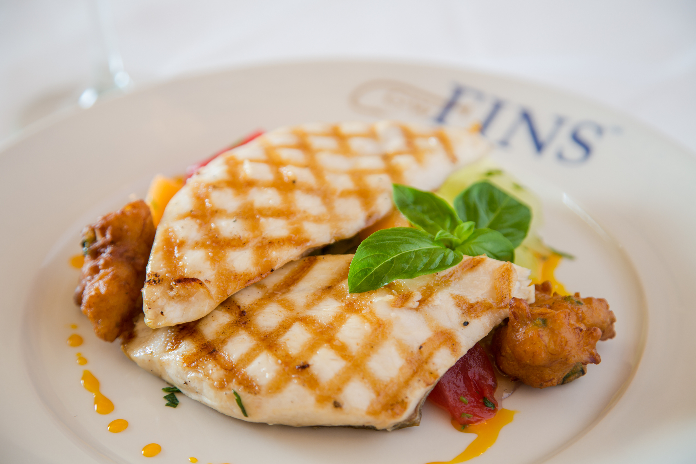 Charcoal Grilled Louisiana Pompano with Vietnamese-style Mirliton Slaw (goi thap cam) and Spicy Blue Crab Fritters, Pepper Jelly and Citrus Chili Oil