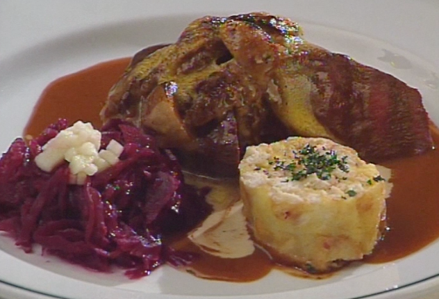 Saddle of Venison in Juniper Cream Sauce au Gratin with Mushrooms, Served with Red Cabbage and Sliced Bread Dumplings ▶