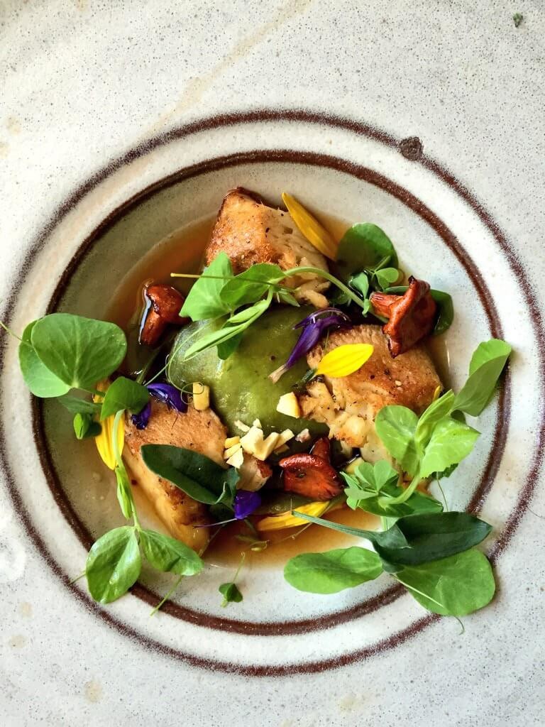 Bone Marrow ln Pine Needle Ravioli with Juniper, Mushroom Broth, Foraged Lion’s Mane Mushrooms, Sheep Sorrel & Local Chestnuts