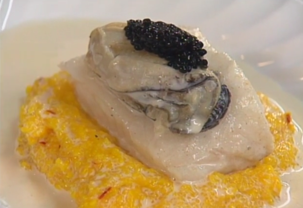 Sea Bass on Grits with Saffron, Oysters, and Caviar-Champagne Sauce