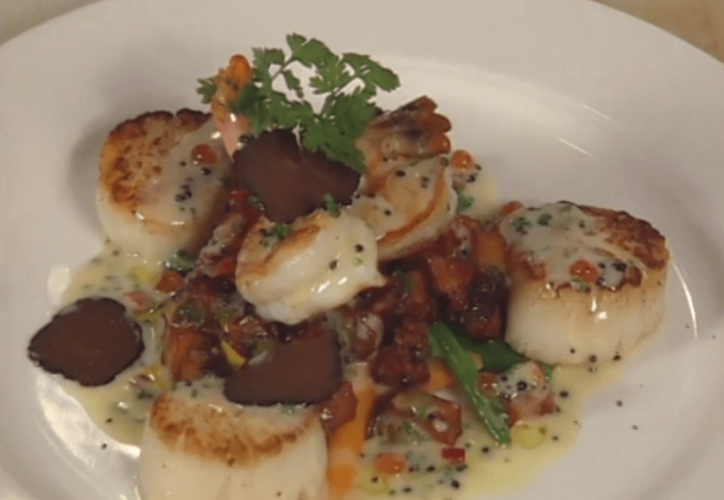 Pan-seared Diver Scallops and Jumbo Gulf Shrimp with Truffle-scented New Potato Hash and Caviar Butter