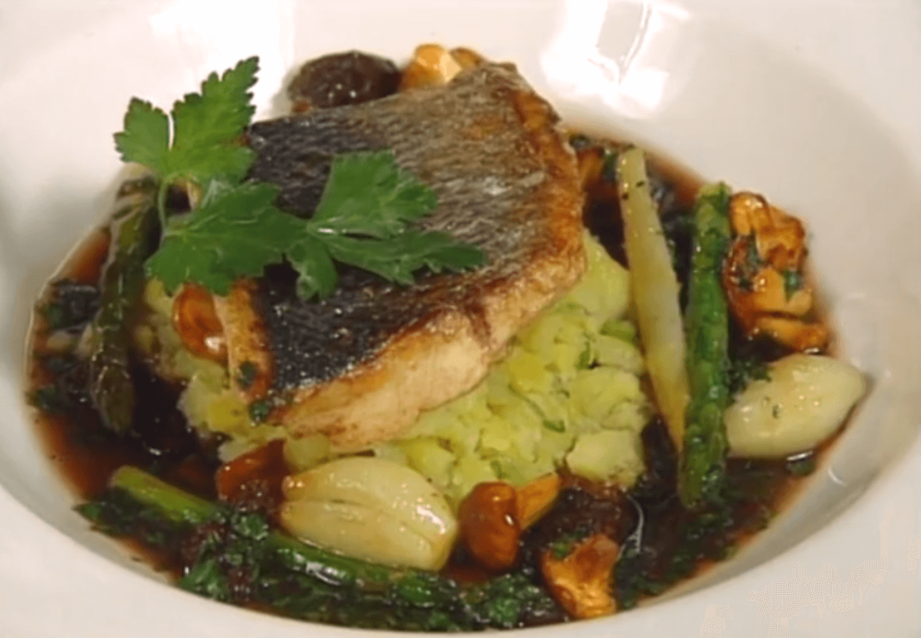 Sea Bass on Crushed Scallion Potatoes with Caramelized Spring Vegetables
