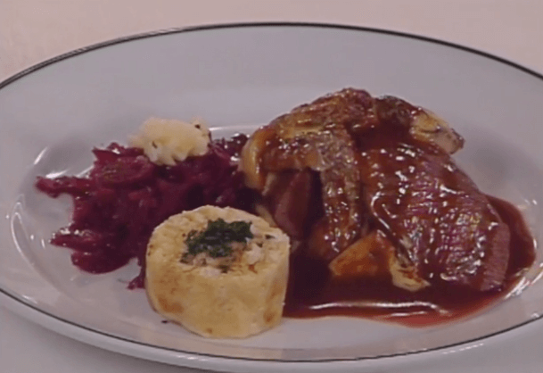 Saddle of Venison in Juniper Cream Sauce au Gratin with Mushrooms, Served with Red Cabbage and Sliced Bread Dumplings