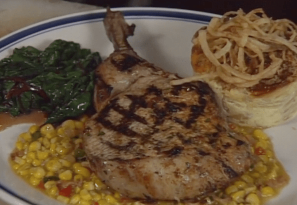 Chipotle-marinated Grilled Pork Chop with Fried Corn Sauce, Vidalia  Onion Pudding, and Swiss Chard
